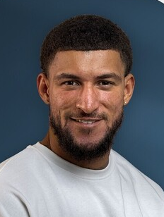 A picture of Reece Batchelor, talent lead at Photoroom