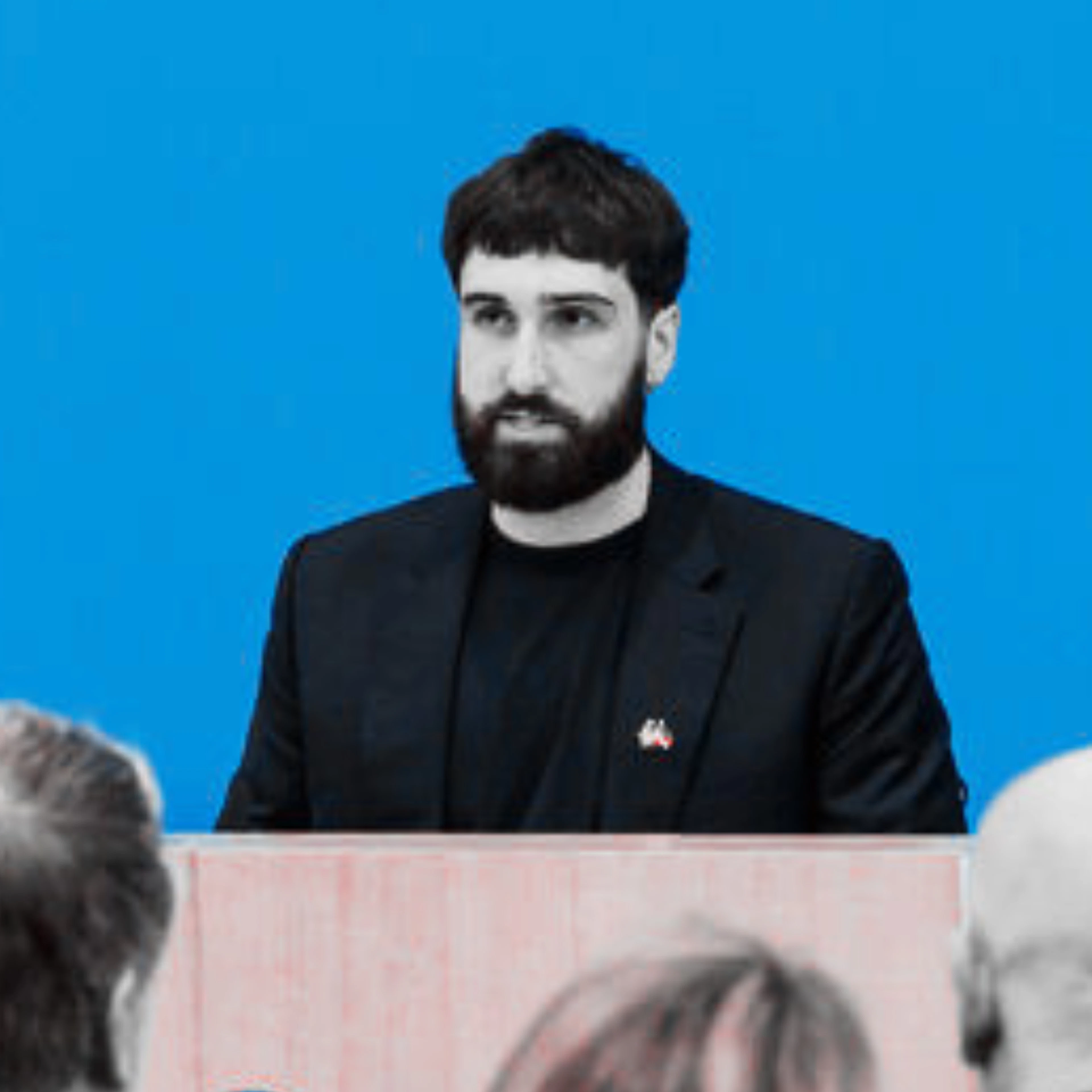 (Left to right) Aleph Alpha cofounder Samuel Weinbach, Cohere CEO Aidan Gomez and Canadian tech minister Evan Solomon announce the merger at a press conference last week